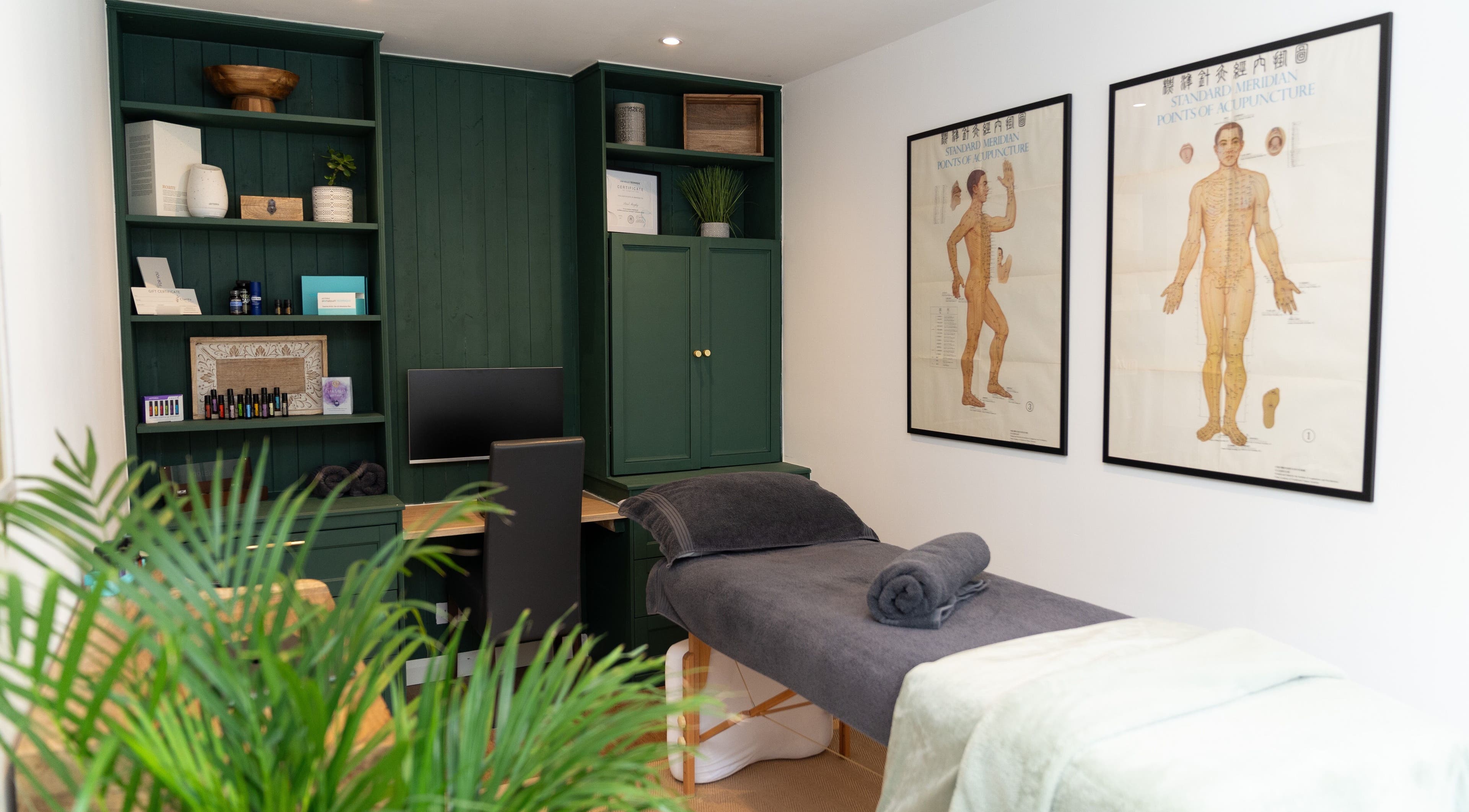 Relaxing treatment room at Clarity Acupuncture, Northampton, England, GB, featuring a massage bed and decor.