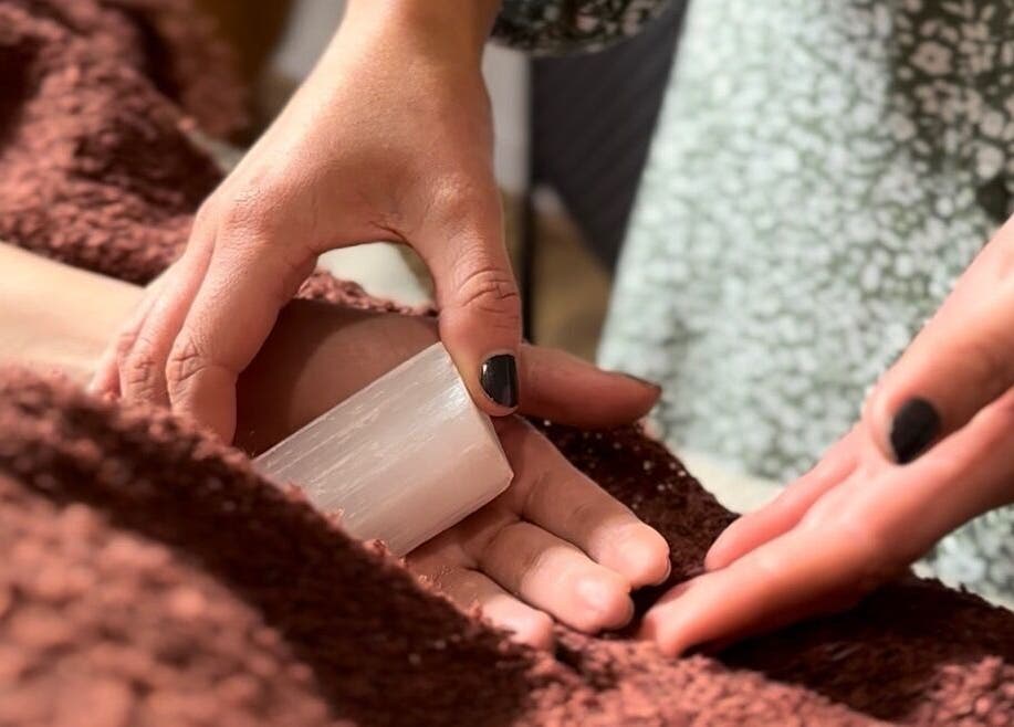 Hands using healing crystals at Smudge Studio, Limerick, County Limerick, IE for a wellness ritual.