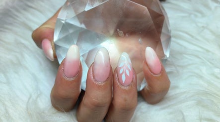 Elegant nude ombre nails with leaf accents, expertly done at Cute Icles, Ceres, Western Cape, ZA.
