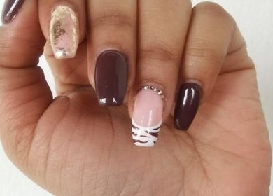 Manicured hand with unique nail art at Cute Icles, Ceres, Western Cape, ZA.