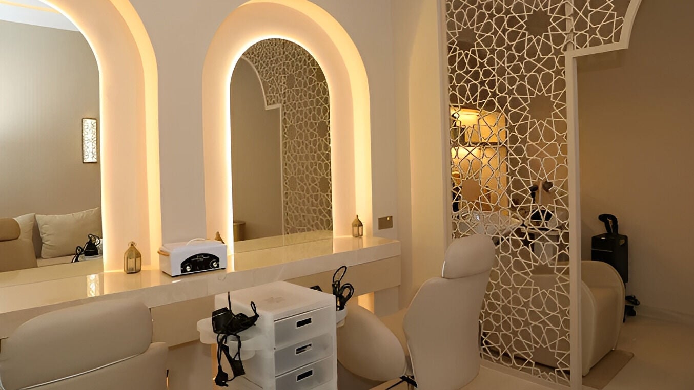 Luxurious interior of Shade Spa in Sharjah, AE, featuring elegant mirrors and plush seating.
