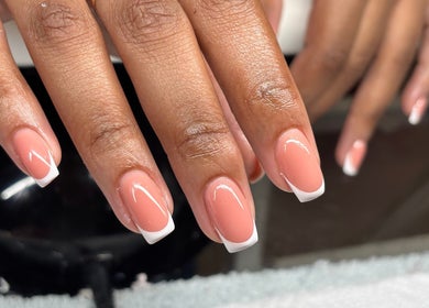 Elegant French manicure at Polished, Berea, Kwazulu-natal, ZA showcasing glossy nails.