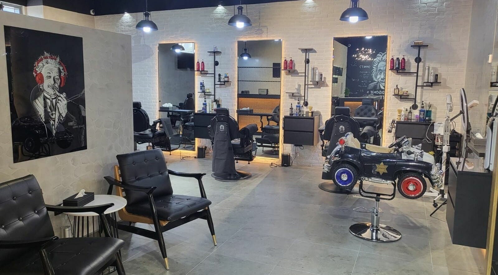 Stylish interior of Hairstein Gents Salon in Dubai, with sleek chairs and modern decor.
