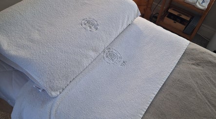 Luxury spa bed at AJM Aesthetics, Donegal Town, County Donegal, IE with plush white linens.