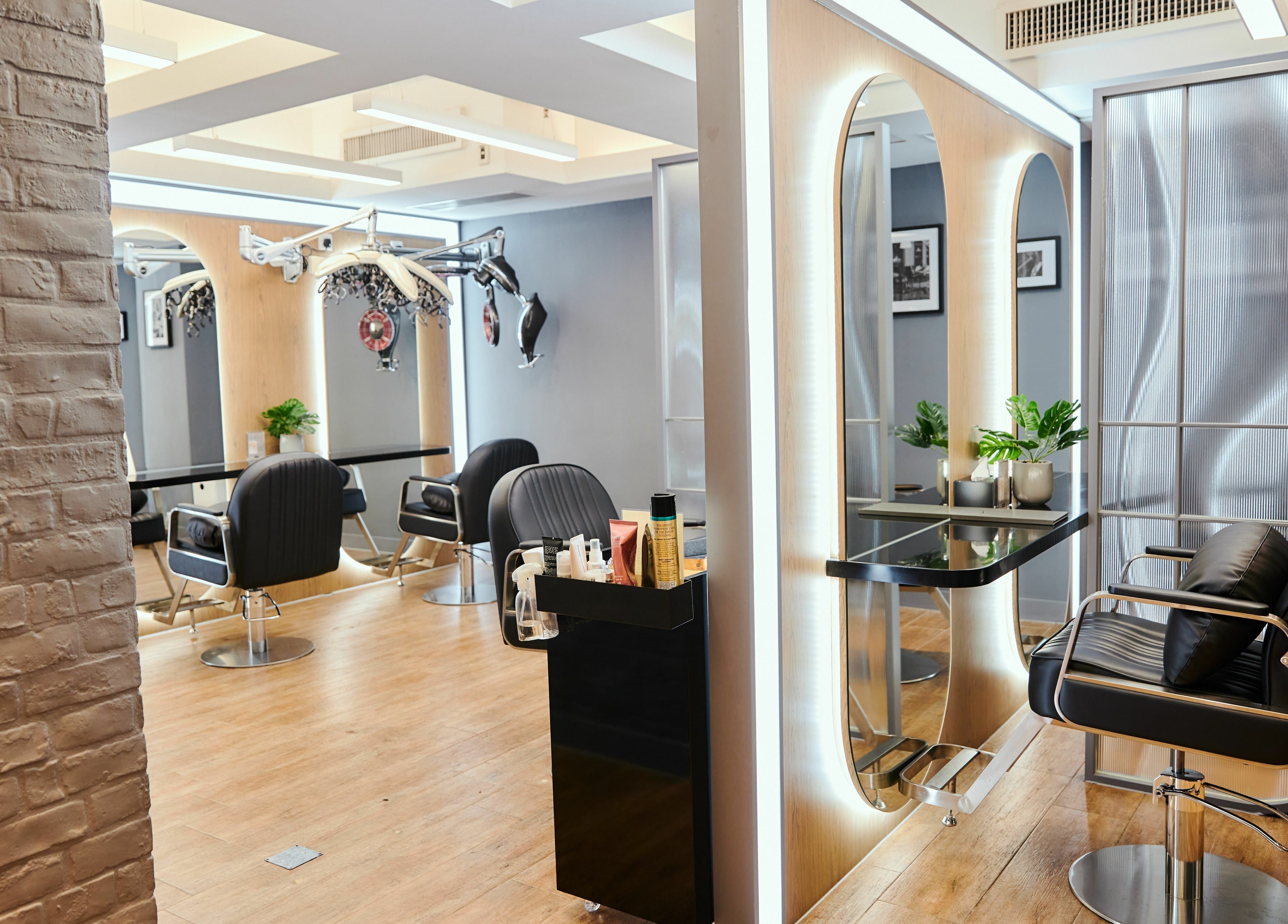 Interior of The Beau Barbershop & Hair Salon, Hong Kong Island, featuring stylish chairs and décor.
