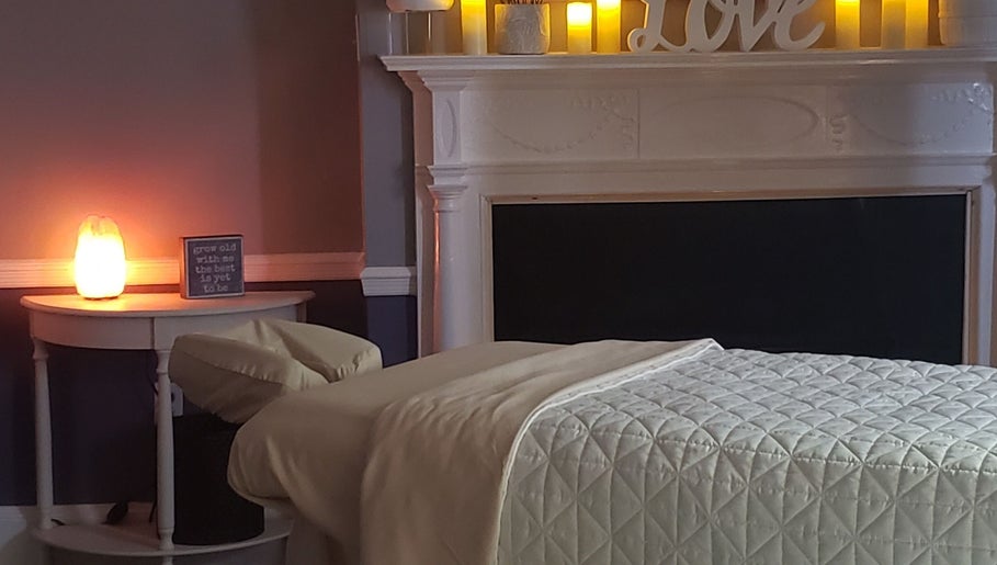 Effleurage Spa's tranquil massage room with soft lighting in Charles Town, West Virginia, US.