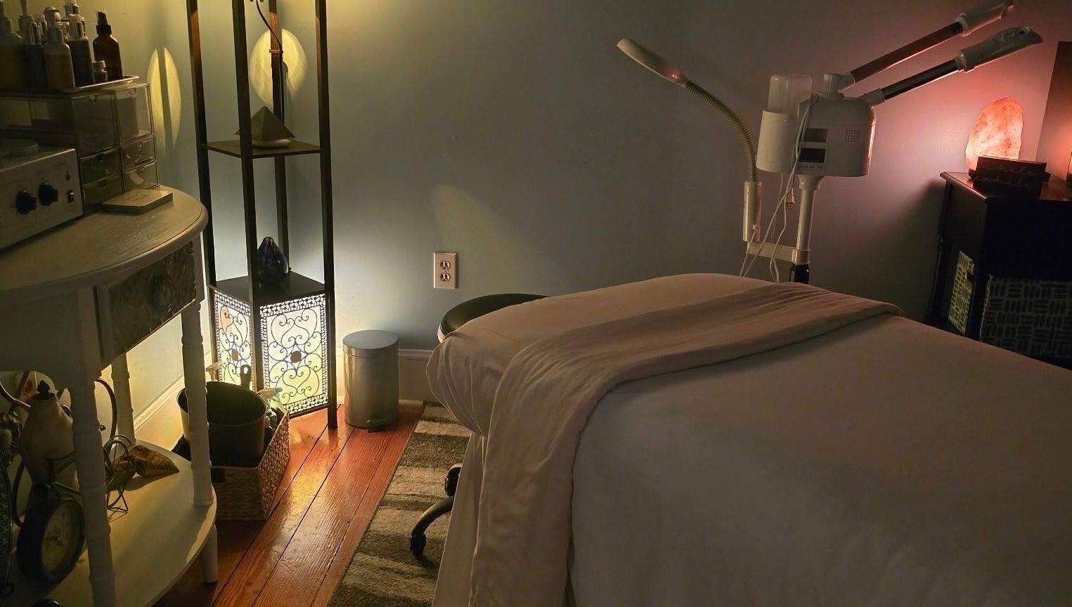 Effleurage Spa's serene therapy room, Charles Town, West Virginia, US. Cozy, ambient lighting for relaxation.
