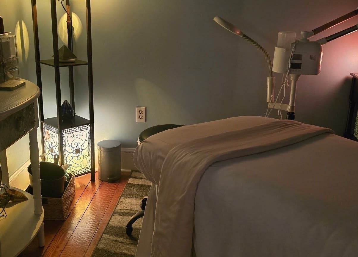 Effleurage Spa's serene therapy room, Charles Town, West Virginia, US. Cozy, ambient lighting for relaxation.