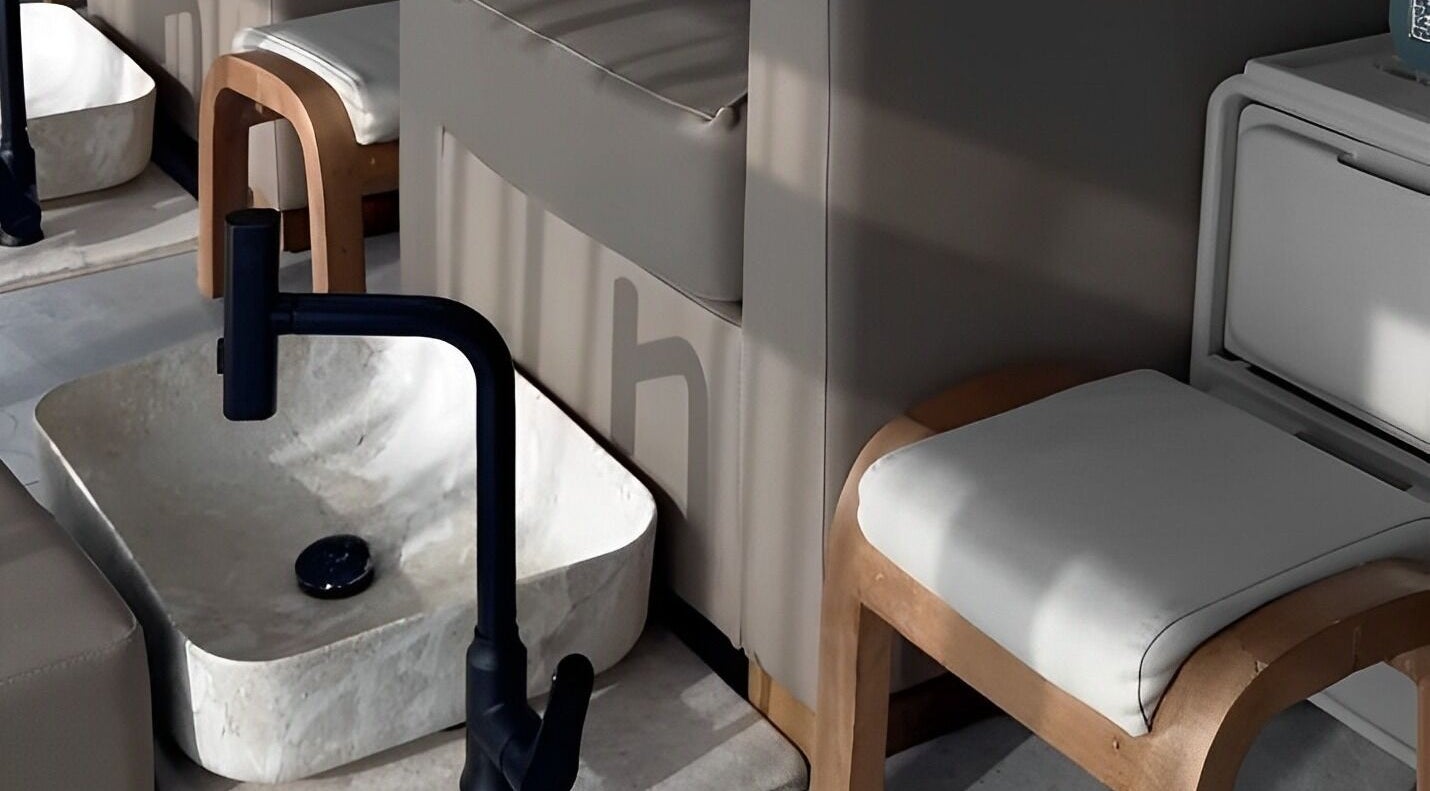 Luxurious pedicure station at Haven Spa Khalifa Branch, Abu Dhabi, Abu Dhabi, AE with modern seating and basin.