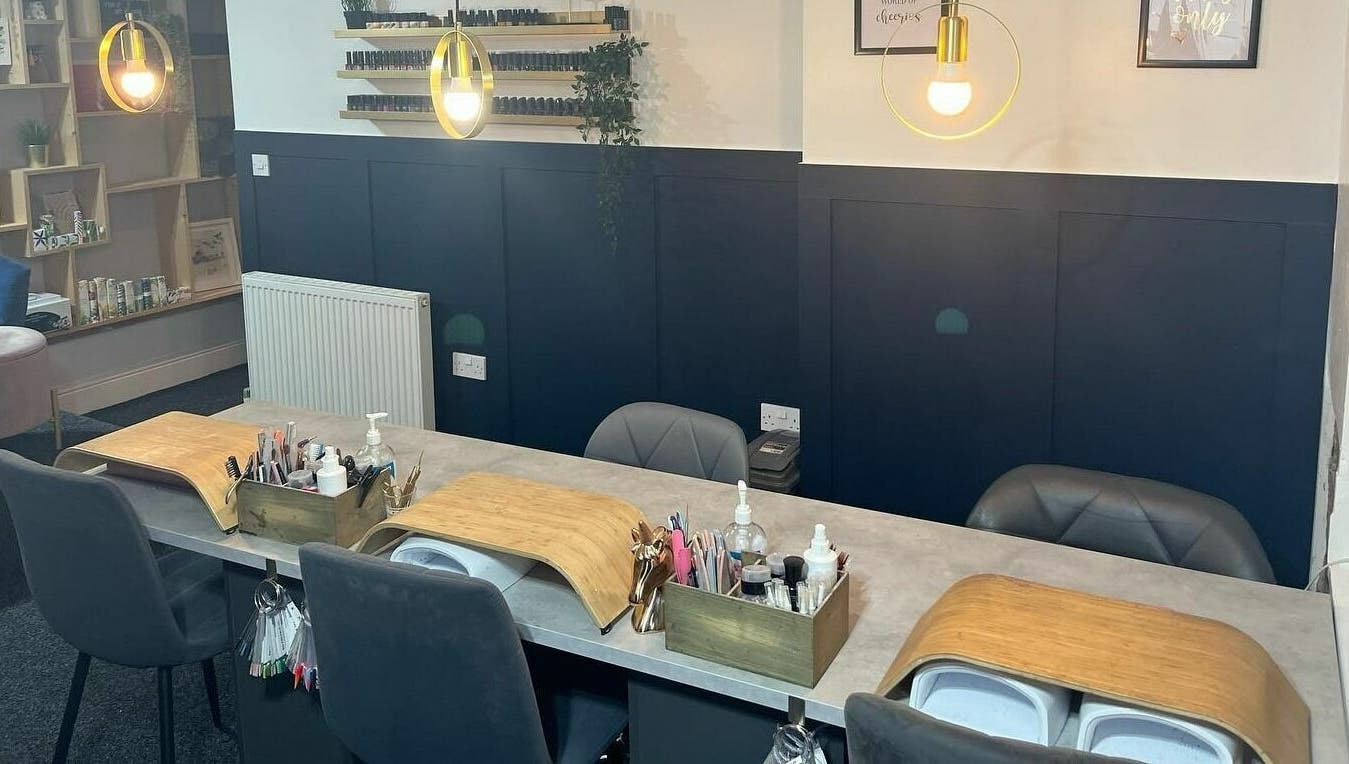 Modern nail salon at Nail'd It, Todmorden, England, GB, showcasing elegant manicure stations.