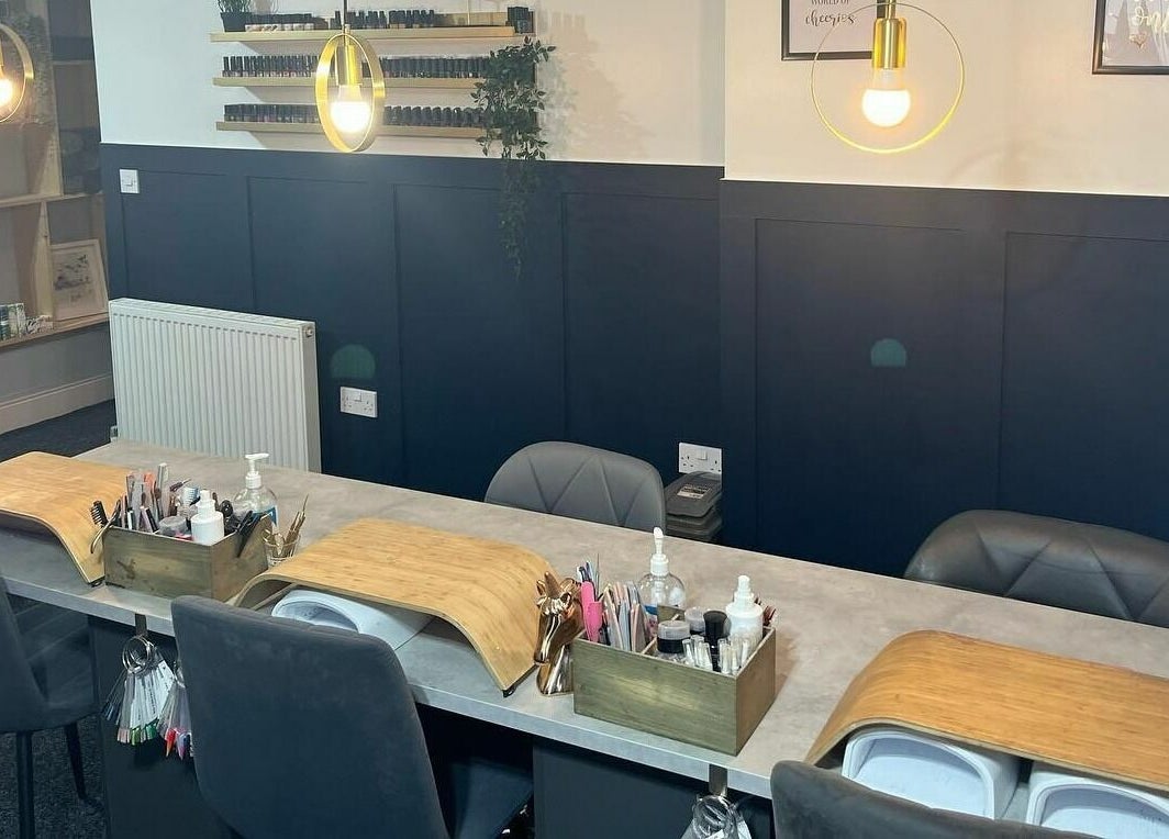 Modern nail salon at Nail'd It, Todmorden, England, GB, showcasing elegant manicure stations.