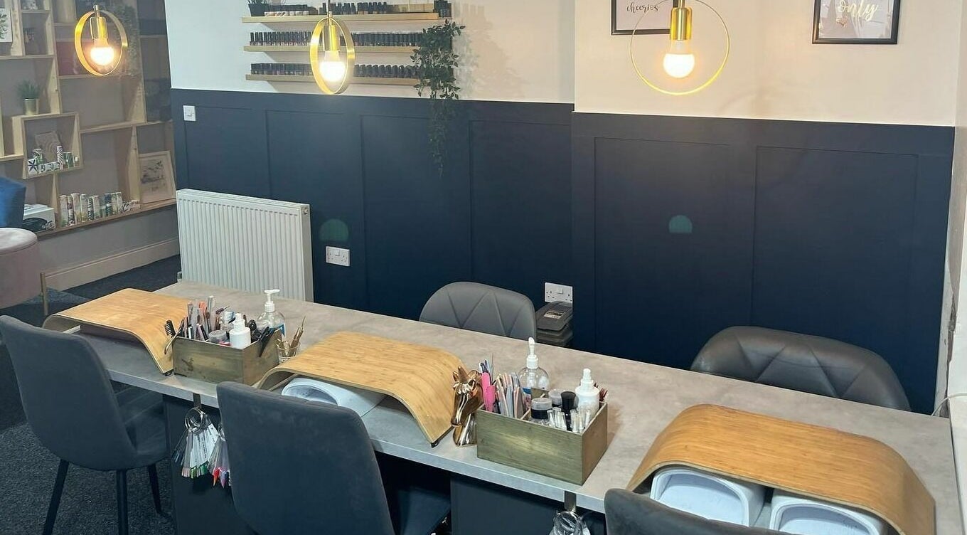 Modern nail salon at Nail'd It, Todmorden, England, GB, showcasing elegant manicure stations.
