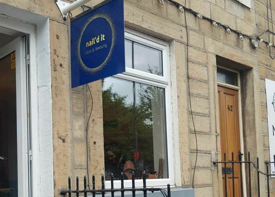 Exterior view of Nail'd It salon in Todmorden, England, GB showcasing the entrance and signage.