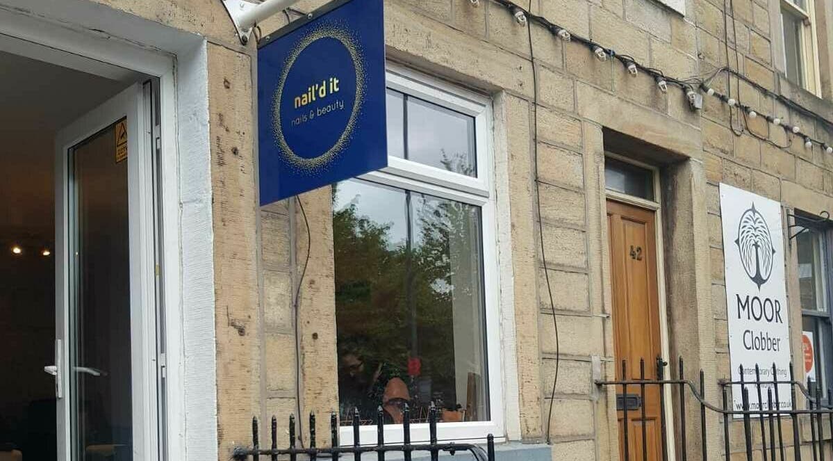 Exterior view of Nail'd It salon in Todmorden, England, GB showcasing the entrance and signage.