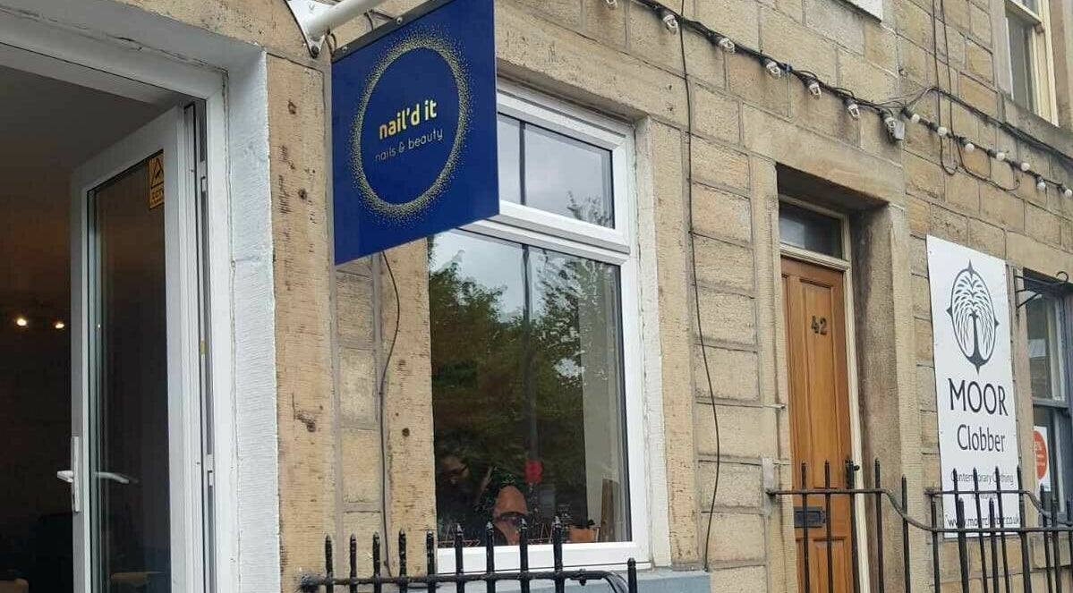Exterior view of Nail'd It salon in Todmorden, England, GB showcasing the entrance and signage.