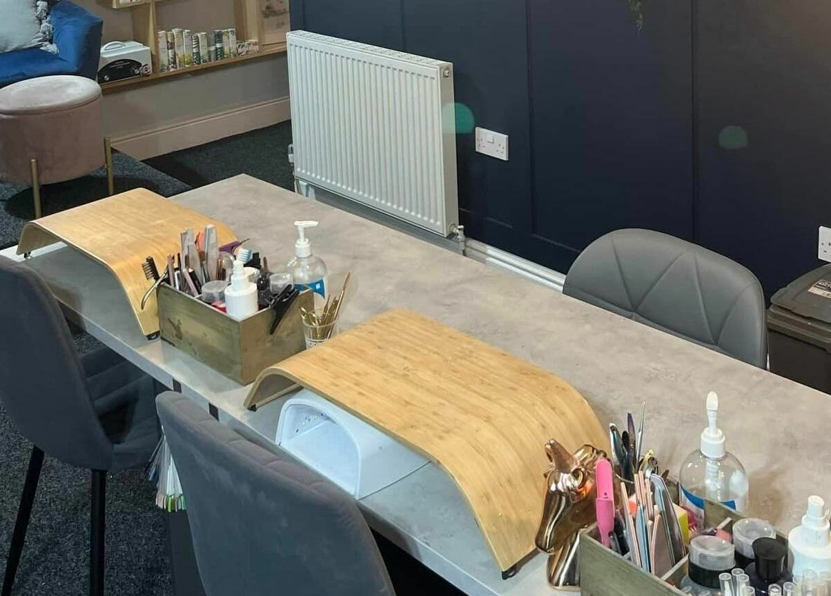 Nail'd It venue in Todmorden, England, features a sleek nail workstation with tools and ergonomic chair.