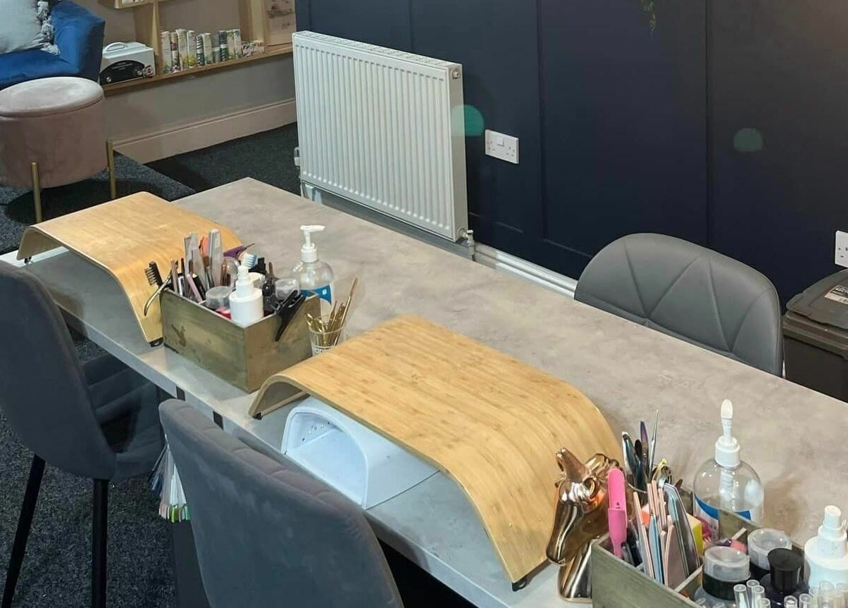 Nail'd It venue in Todmorden, England, features a sleek nail workstation with tools and ergonomic chair.