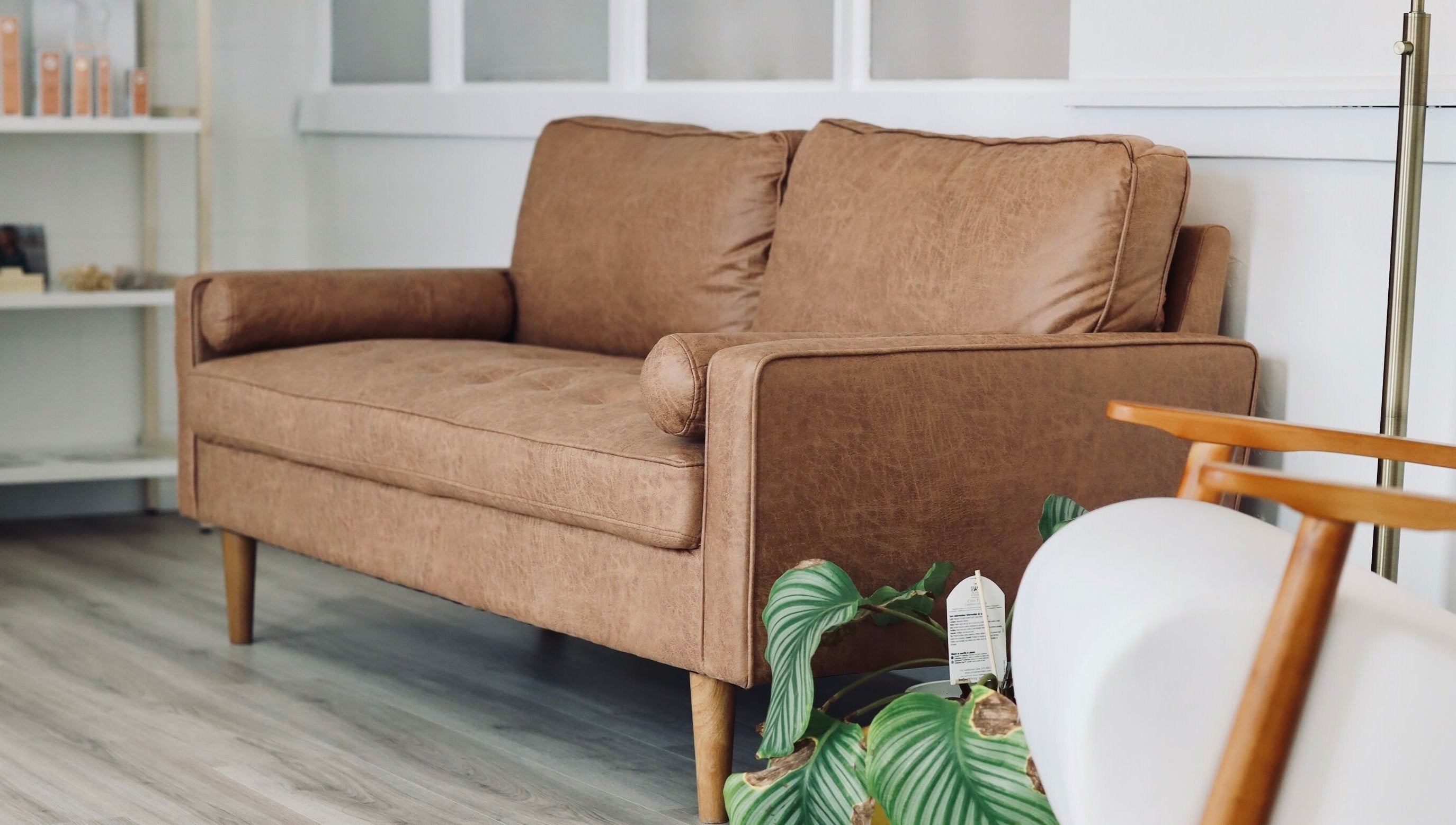 Cozy sofa at Cyr Aesthetics, Petawawa, Ontario, CA, offering a welcoming atmosphere.