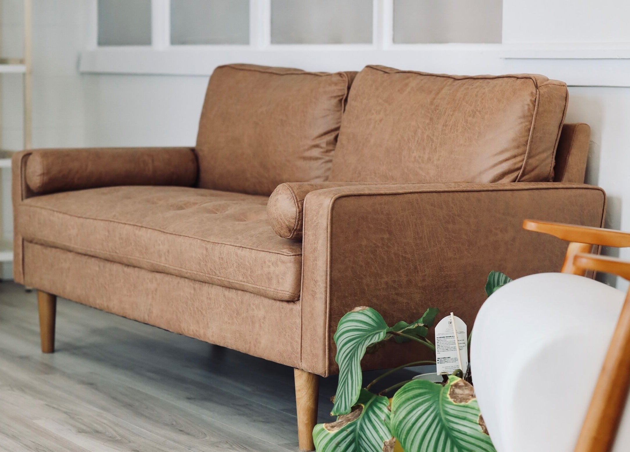 Cozy sofa at Cyr Aesthetics, Petawawa, Ontario, CA, offering a welcoming atmosphere.