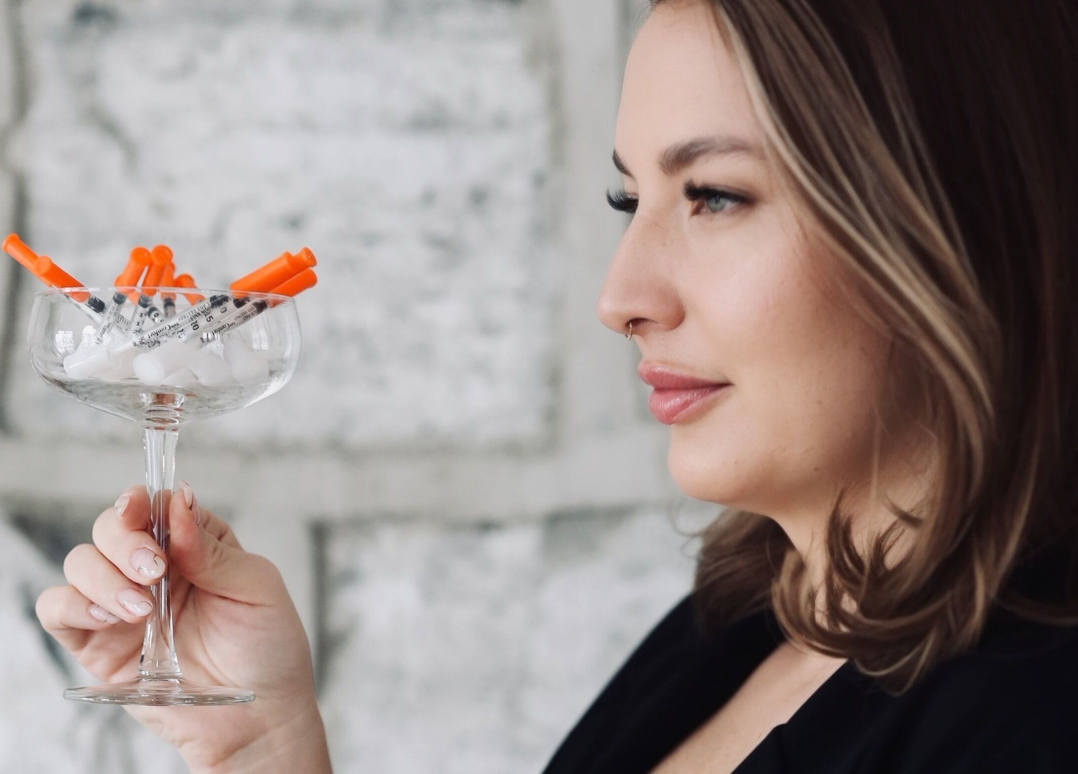 Woman holds cosmetic syringes at Cyr Aesthetics, Petawawa, Ontario, CA.