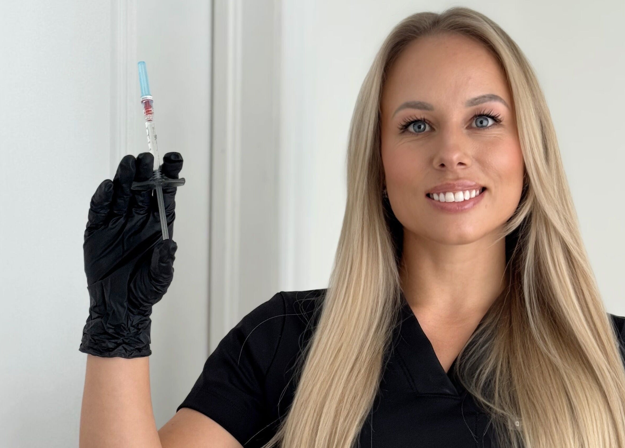 Professional at Cyr Aesthetics in Petawawa, Ontario, CA holding an injection tool with confidence.