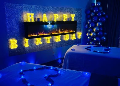 Birthday setup at Elite Massage & Wellness Bloomfield, Bloomfield, Connecticut, US with glowing letters and tables.