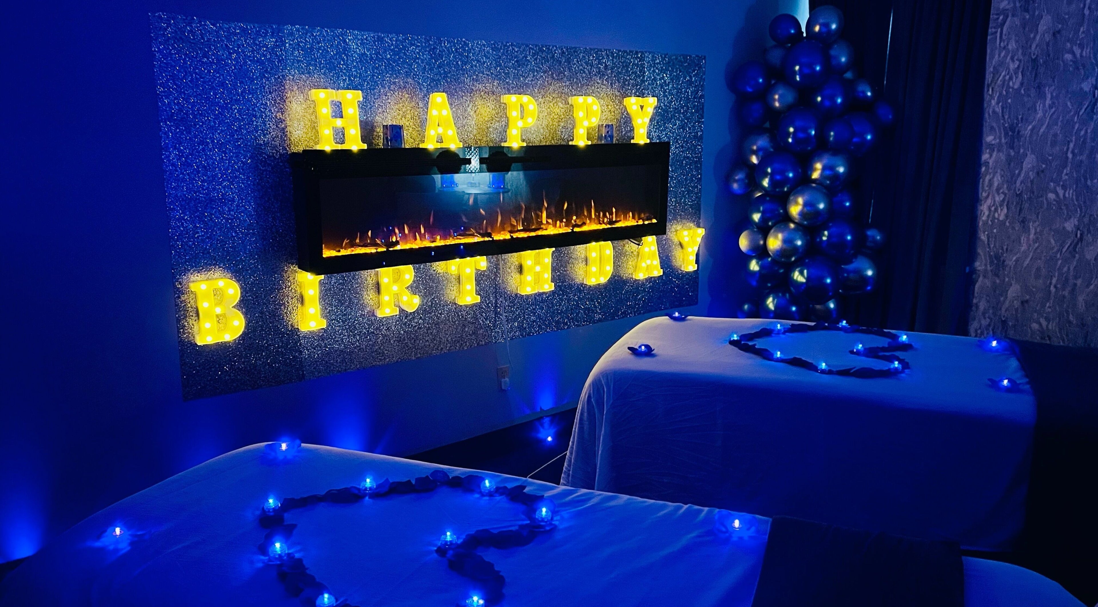 Birthday setup at Elite Massage & Wellness Bloomfield, Bloomfield, Connecticut, US with glowing letters and tables.