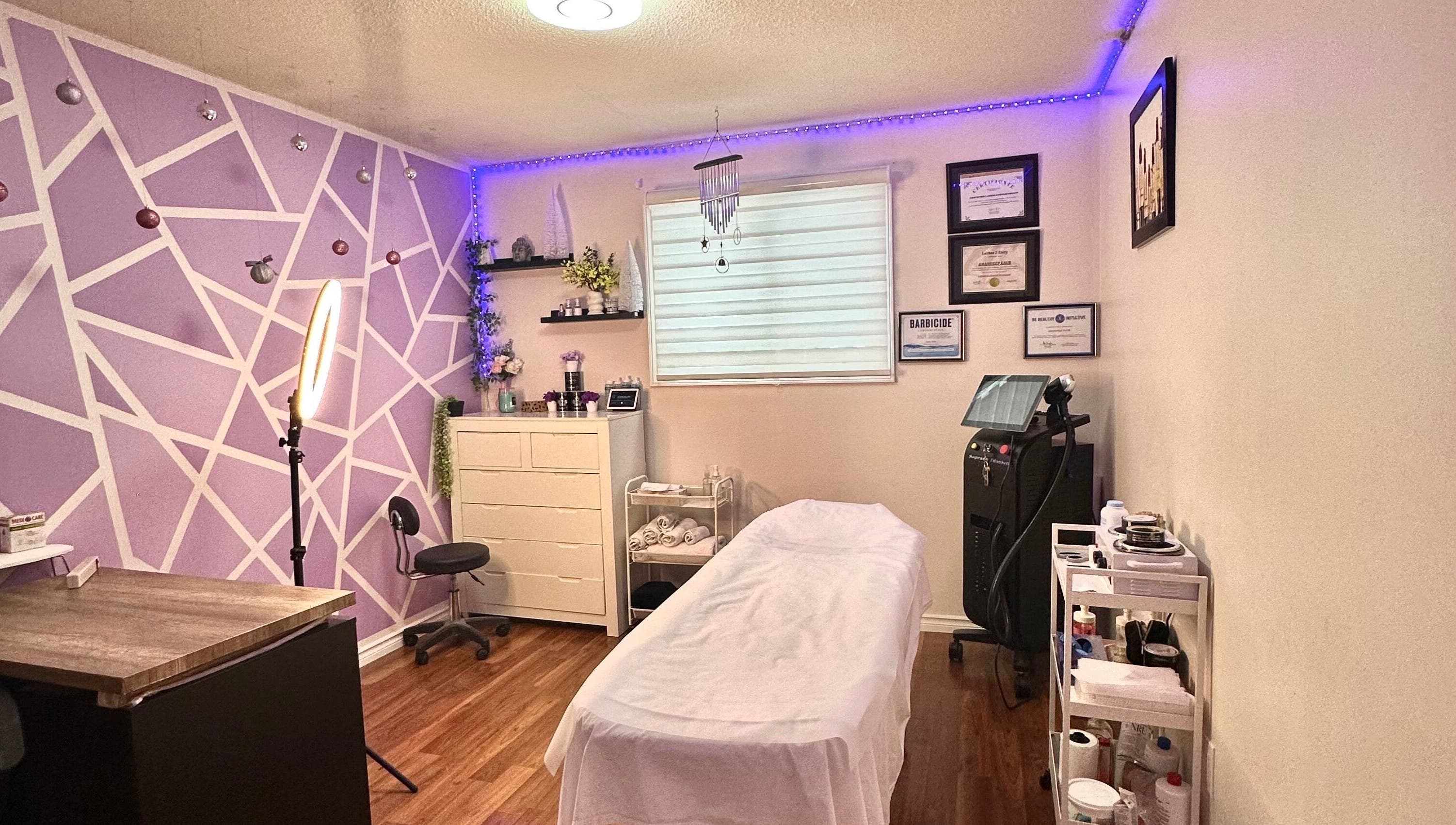 Relaxing spa room at Exotic Touch, Barrie, Ontario, CA, featuring cozy decor and massage table.