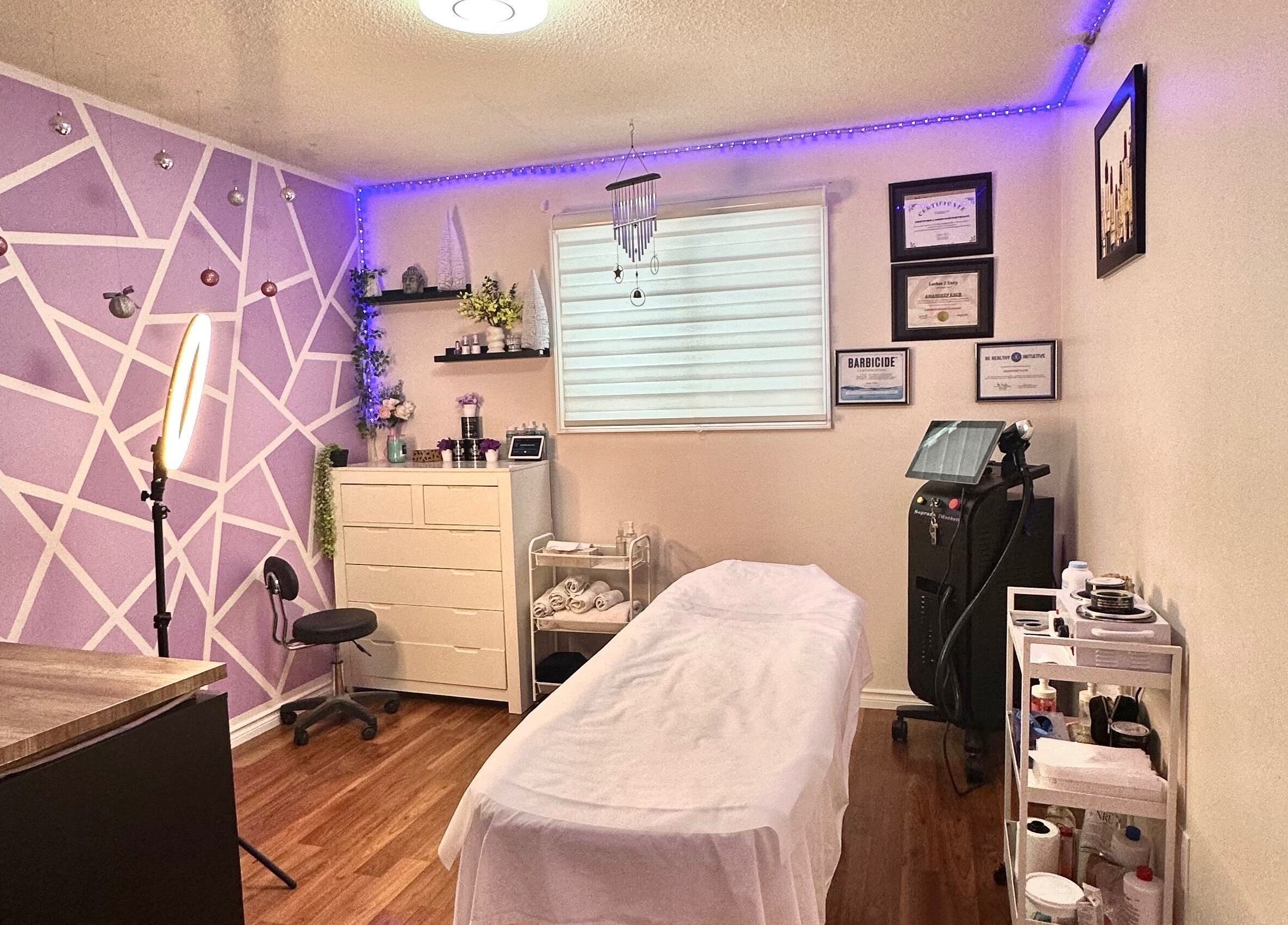 Relaxing spa room at Exotic Touch, Barrie, Ontario, CA, featuring cozy decor and massage table.