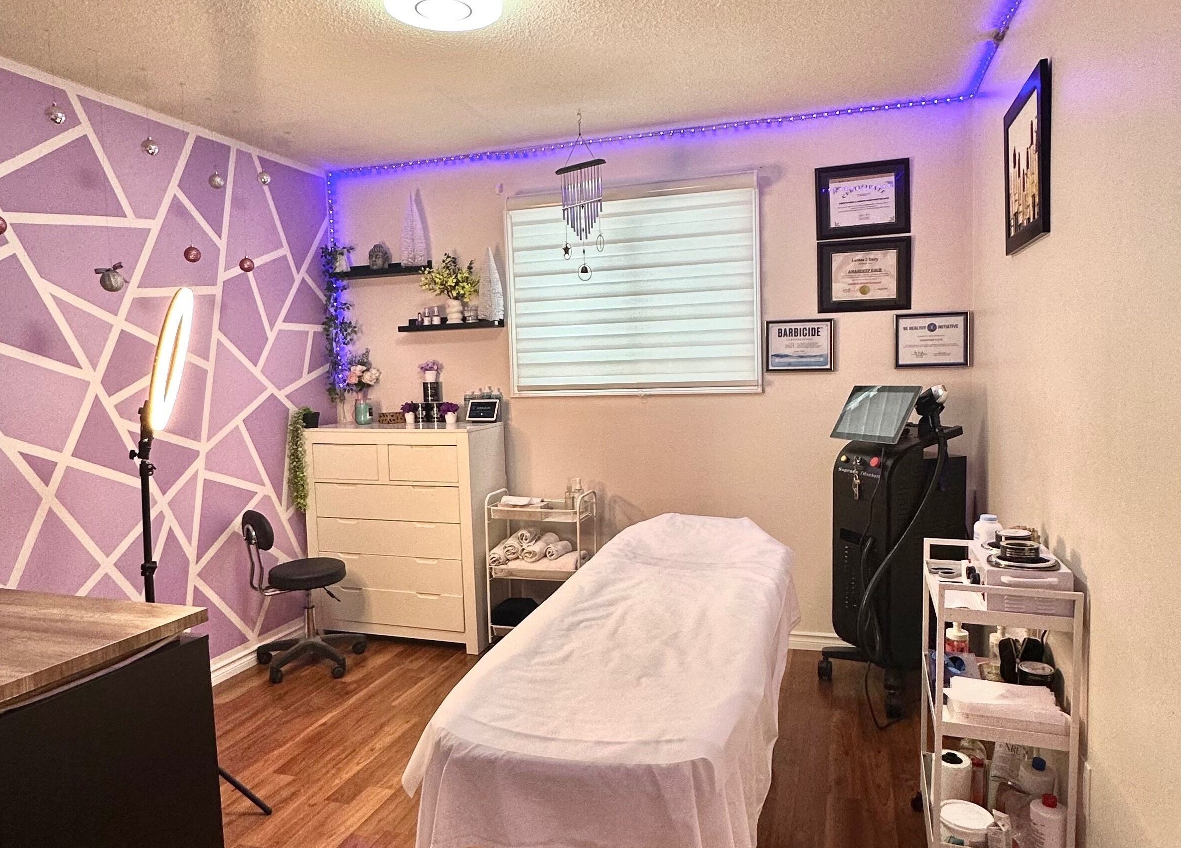 Relaxing spa room at Exotic Touch, Barrie, Ontario, CA, featuring cozy decor and massage table.