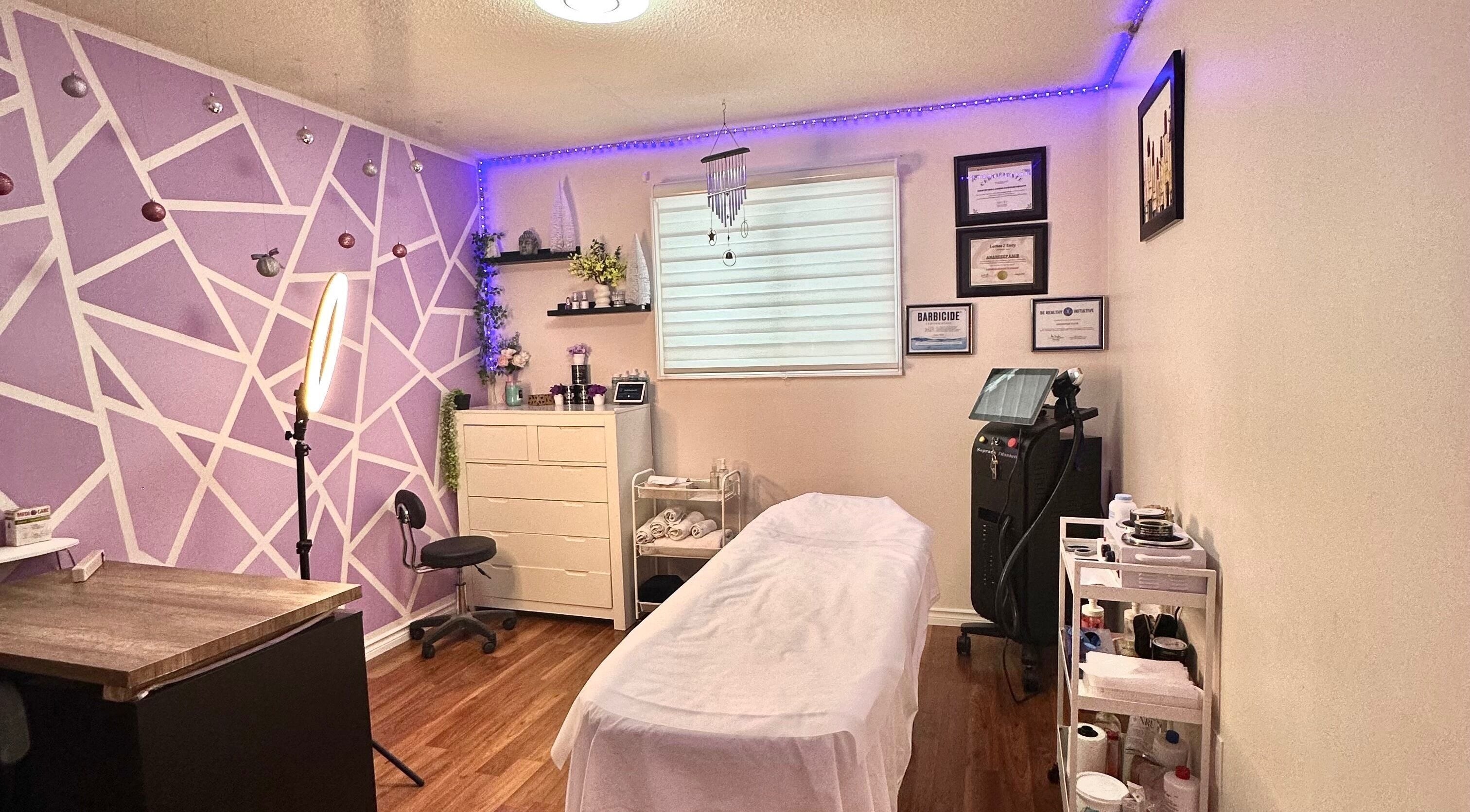 Relaxing spa room at Exotic Touch, Barrie, Ontario, CA, featuring cozy decor and massage table.