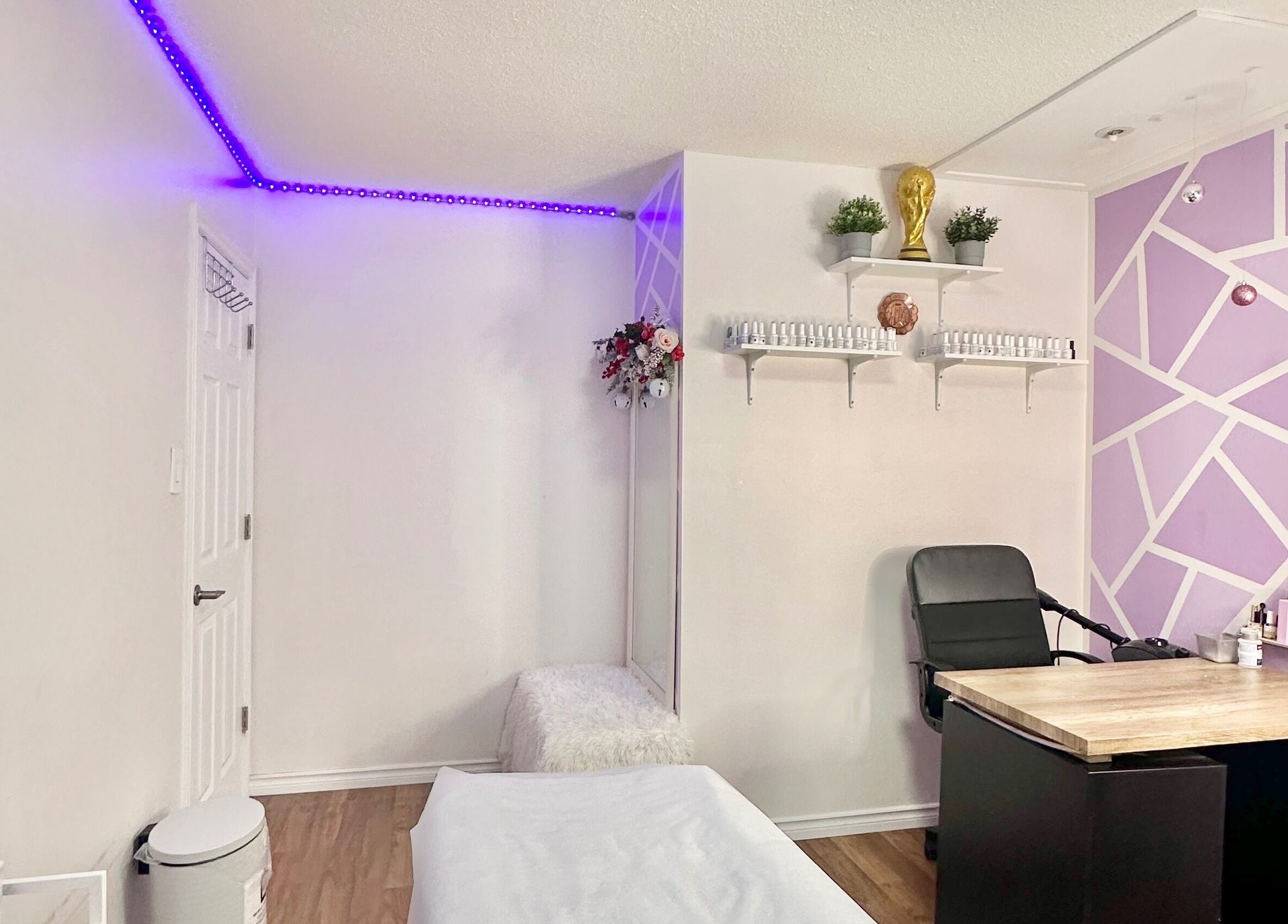 Modern beauty room at Exotic Touch, Barrie, Ontario, CA with purple accents and sleek furnishings.