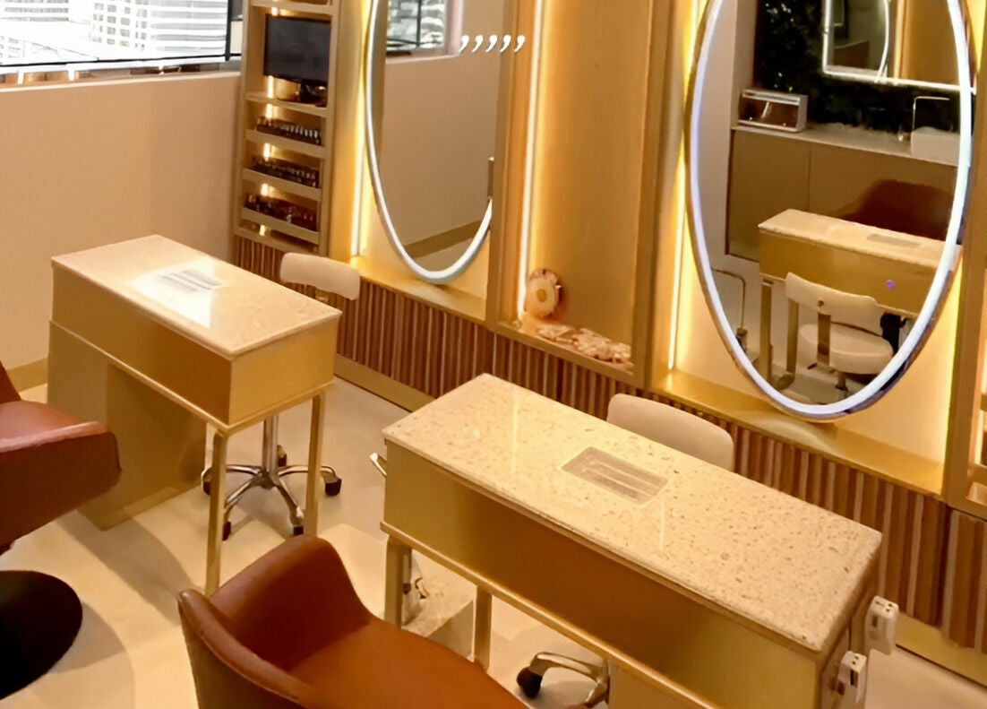 Stylish nail studio at Le Michel Salons Palm Jumeirah, Dubai, Dubai, AE with plush seating and elegant decor.