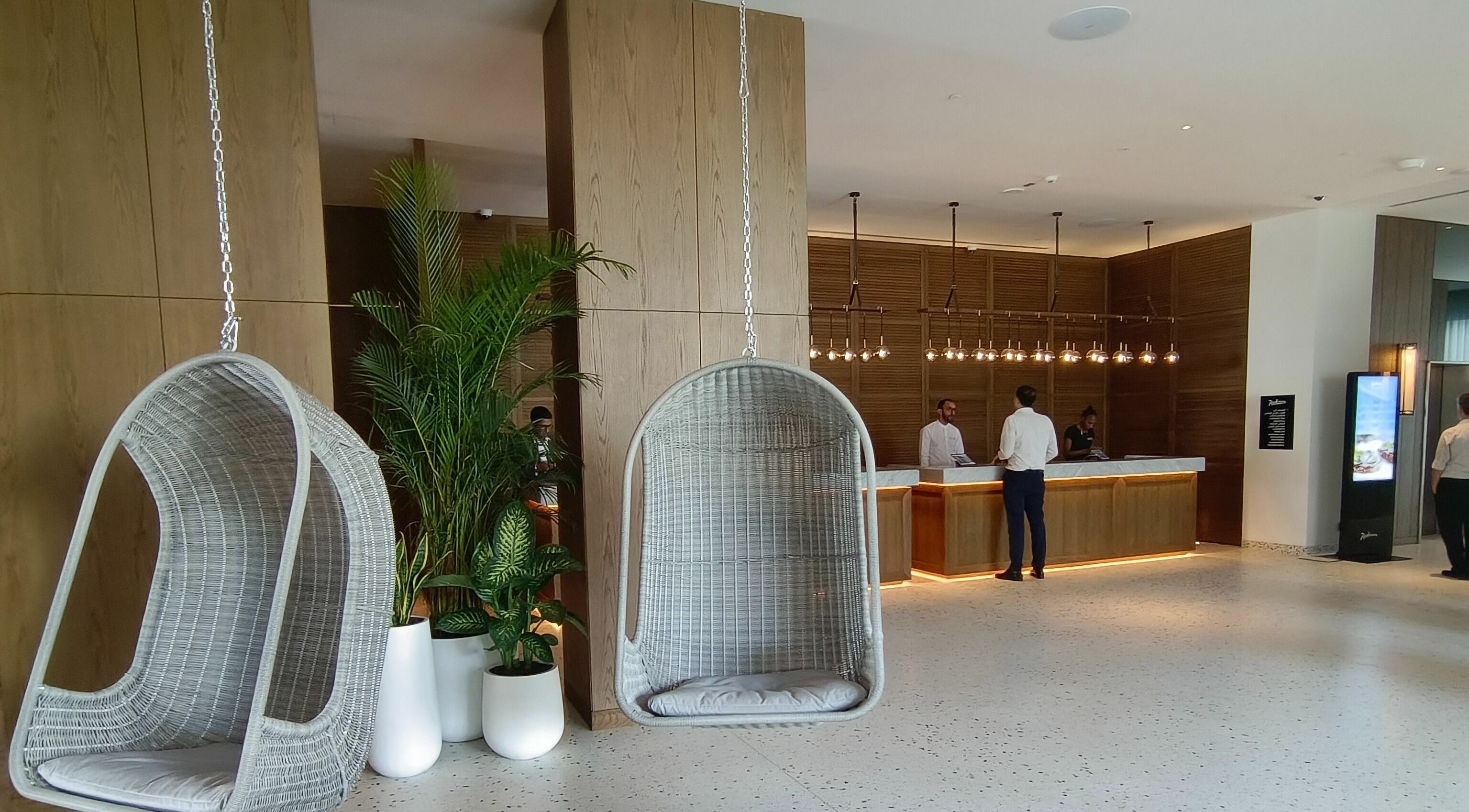 Elegant reception with hanging chairs at Le Michel Salons Palm Jumeirah, Dubai, Dubai, AE.