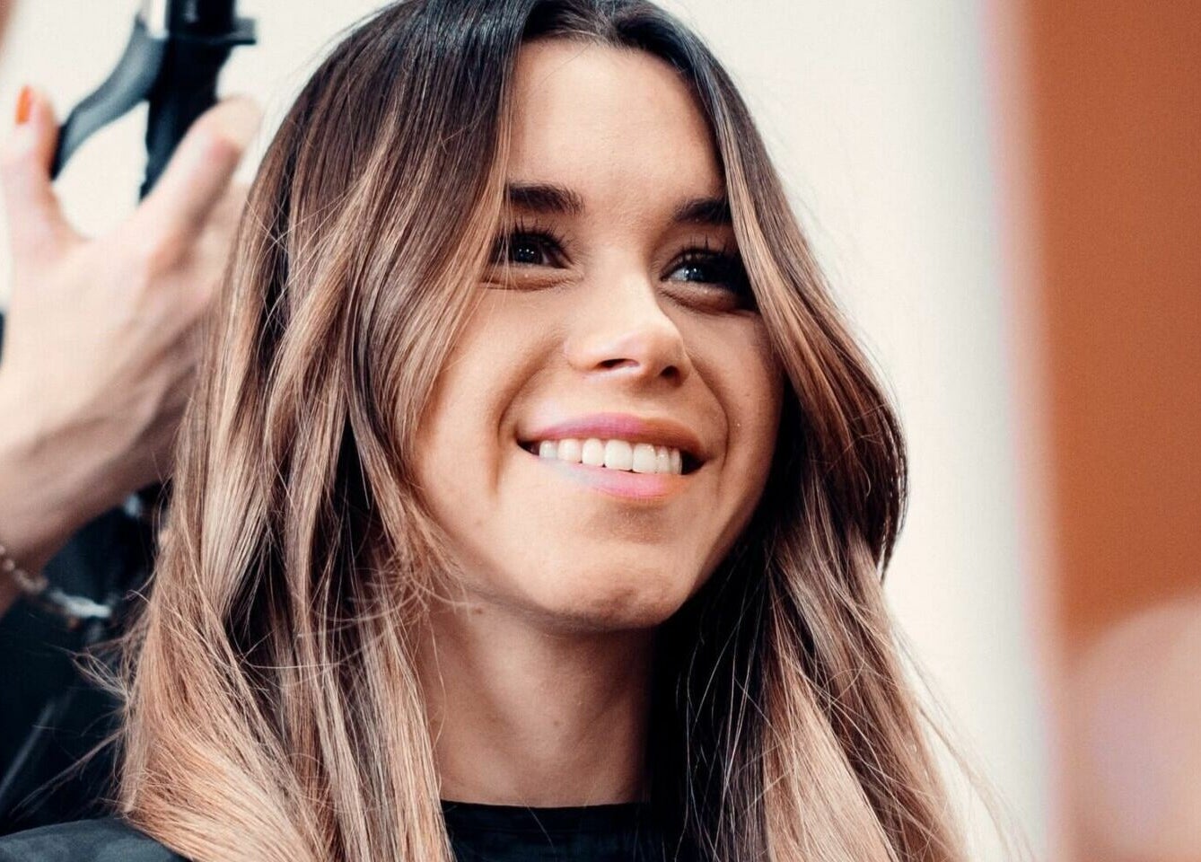 Client smiling during hair styling at Le Michel Salons Palm Jumeirah, Dubai, Dubai, AE.