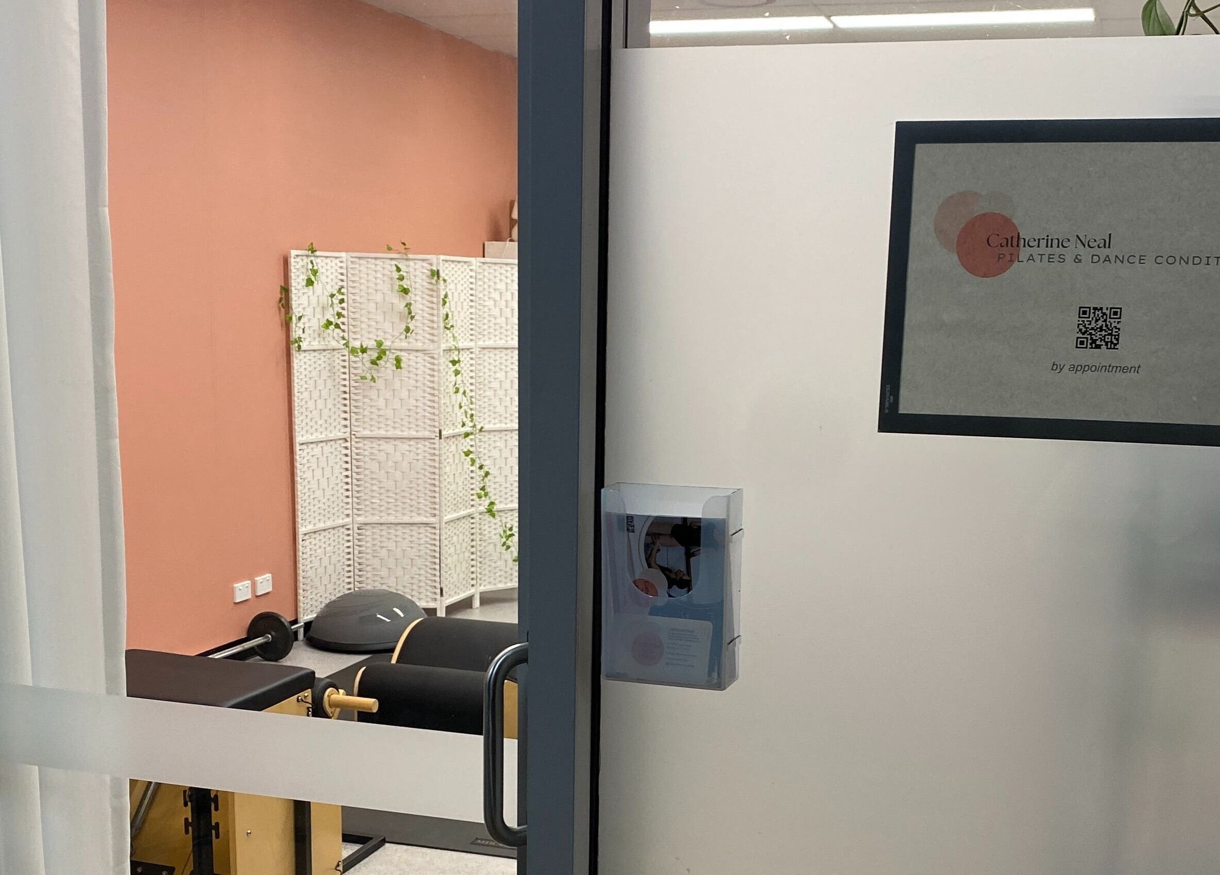 Entrance view of Catherine Neal Pilates studio, Mount Gravatt, Queensland, AU, showcasing modern decor.