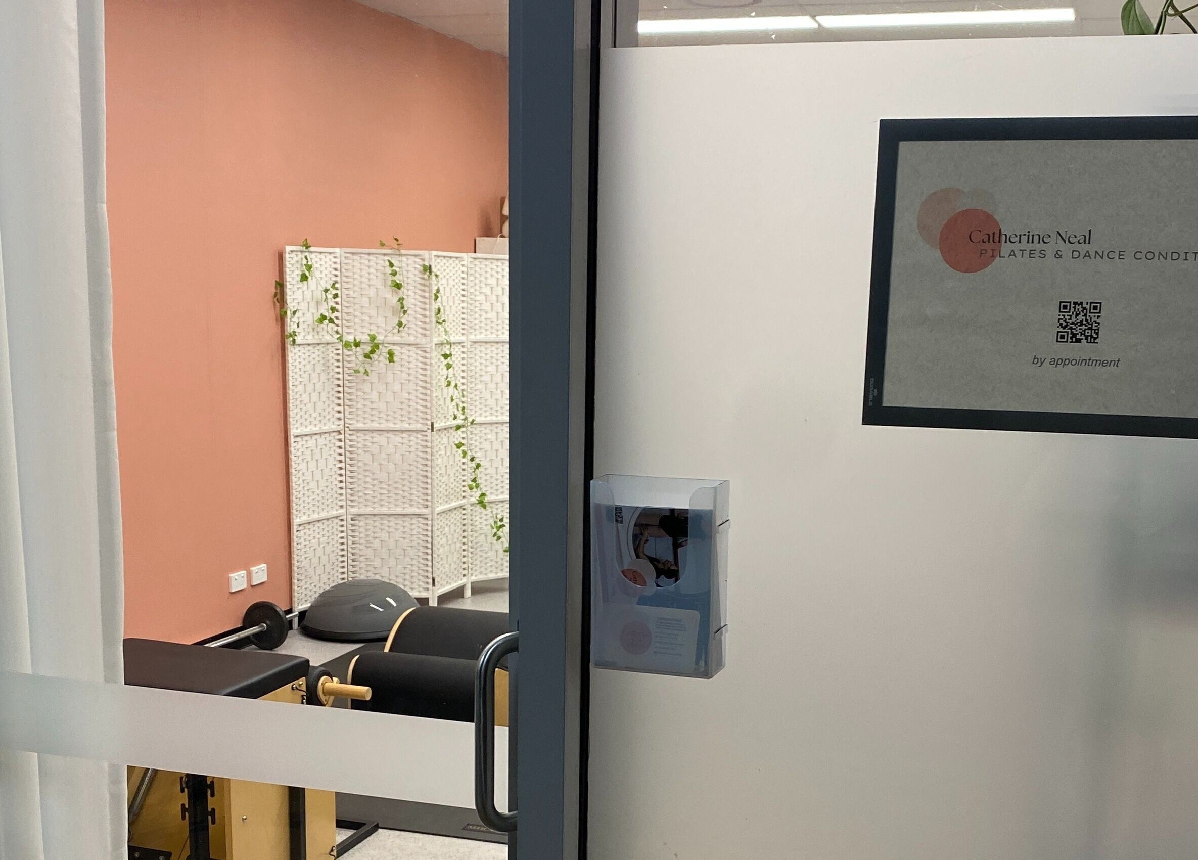 Entrance view of Catherine Neal Pilates studio, Mount Gravatt, Queensland, AU, showcasing modern decor.