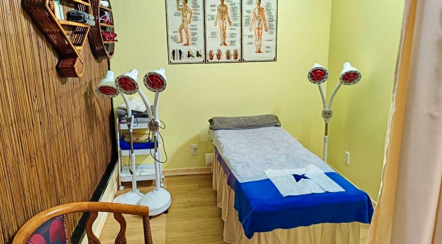 Cozy massage room at Marvel Wellness Massage in Auckland, NZ with bamboo accents and relaxing atmosphere.