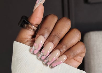 Stylish pink nail art at Thari Spa in Centurion, Gauteng, ZA, showcasing elegant and creative designs.