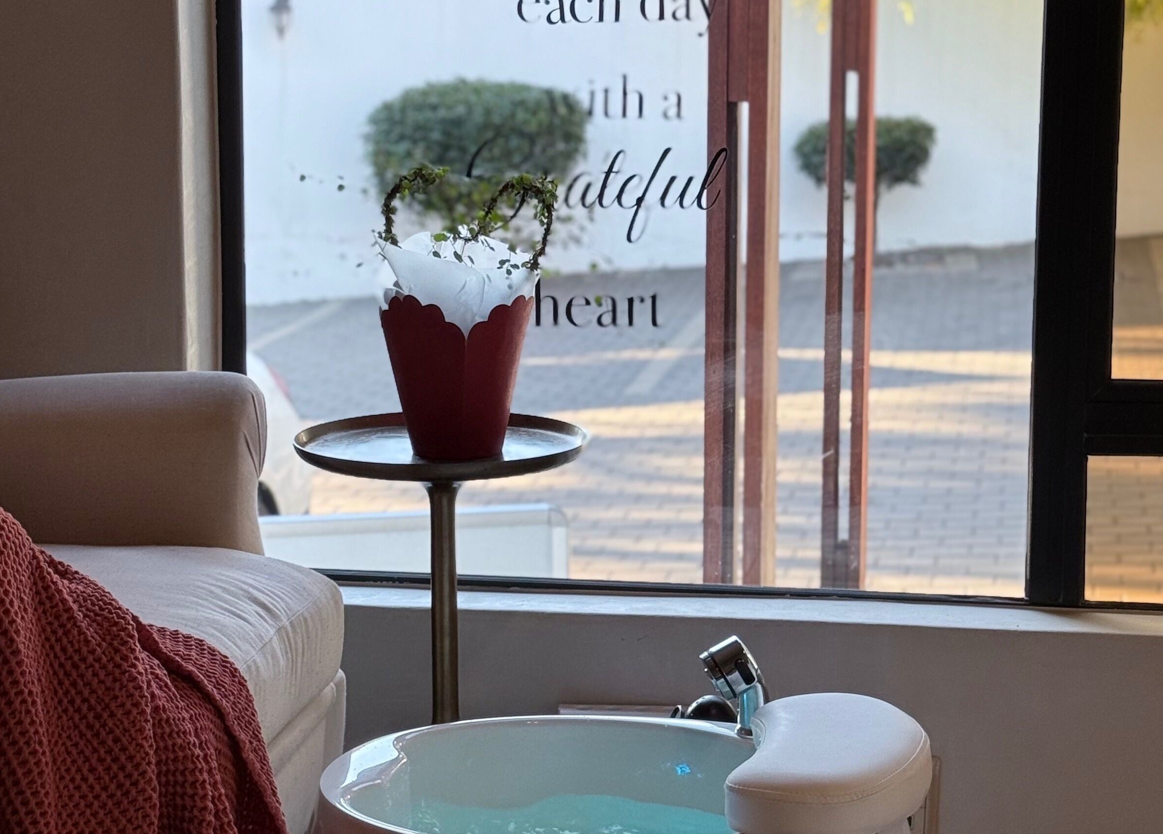Cozy relaxation space in Thari Spa, Centurion, Gauteng, ZA featuring comfortable seating and a foot spa.