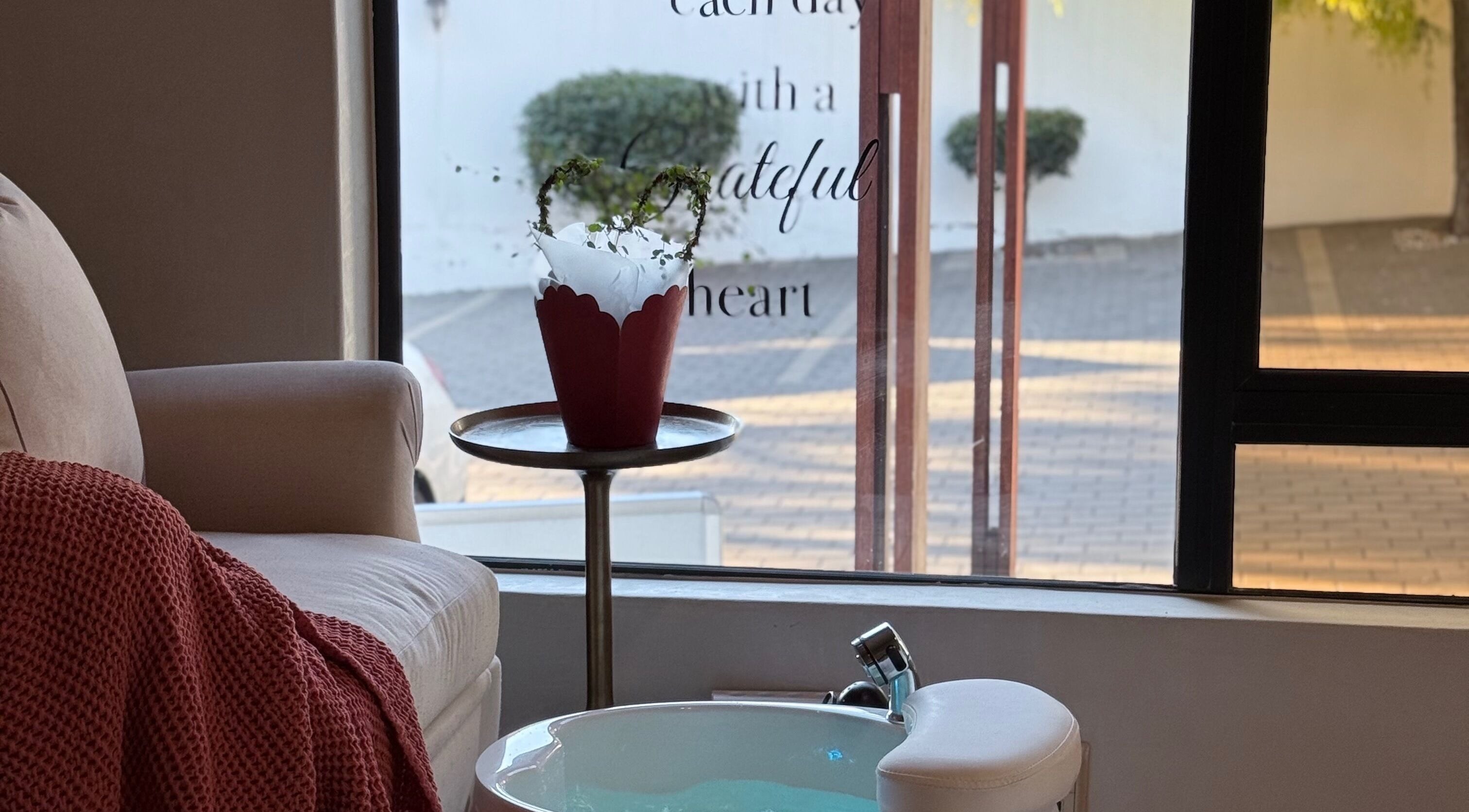 Cozy relaxation space in Thari Spa, Centurion, Gauteng, ZA featuring comfortable seating and a foot spa.