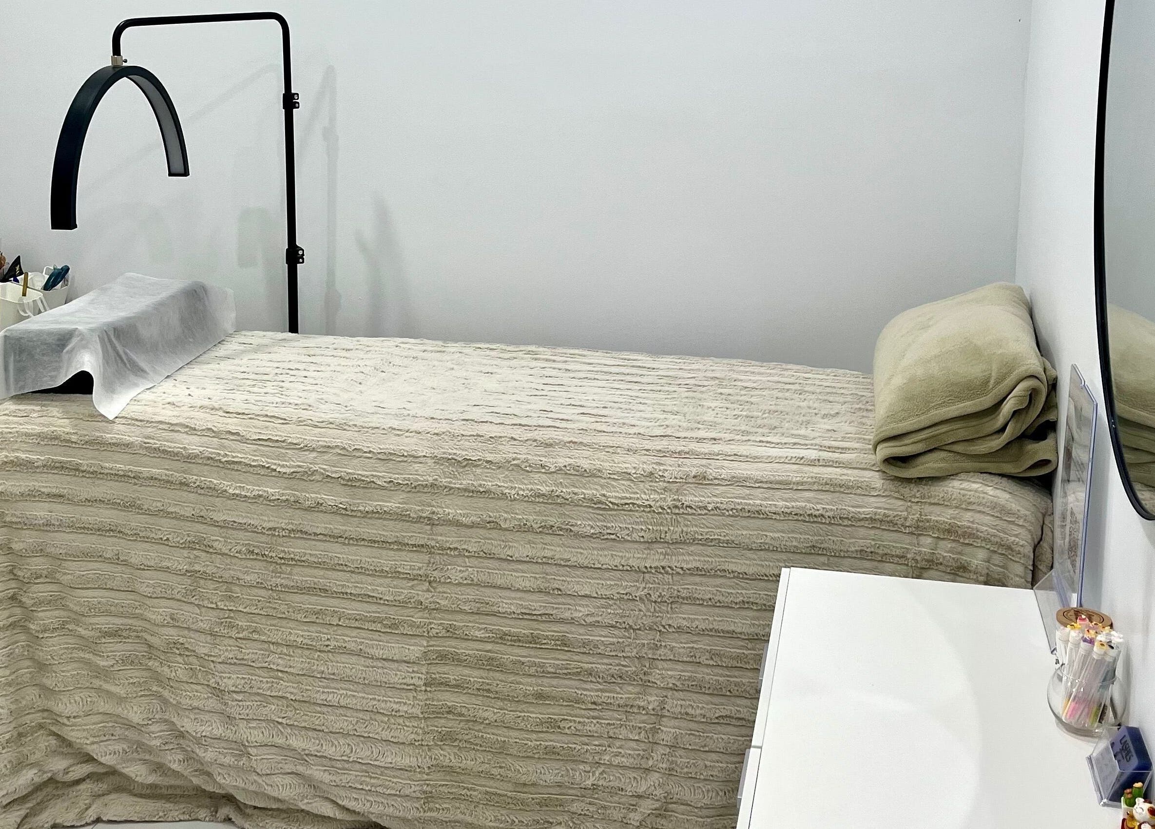 Comfortable treatment bed at Nu Lashes in Yagoona, New South Wales, AU, offering peaceful lash services.