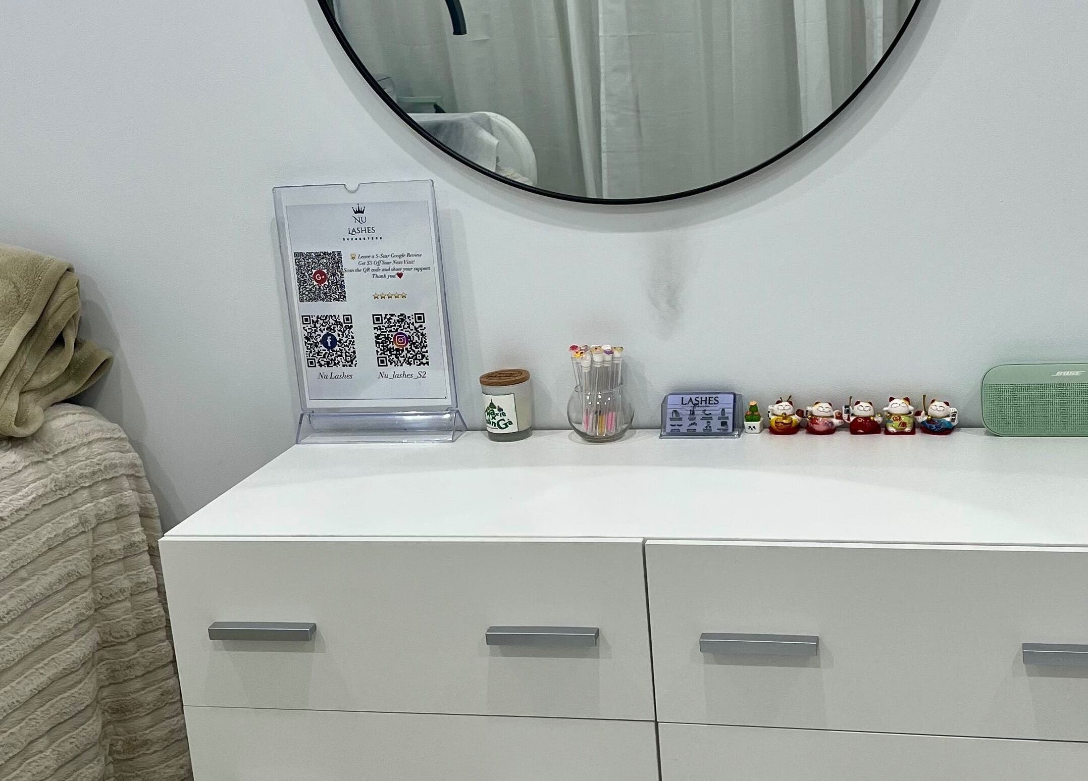 Elegant vanity with decor at Nu Lashes, Yagoona, New South Wales, AU, showcasing beauty and calmness.