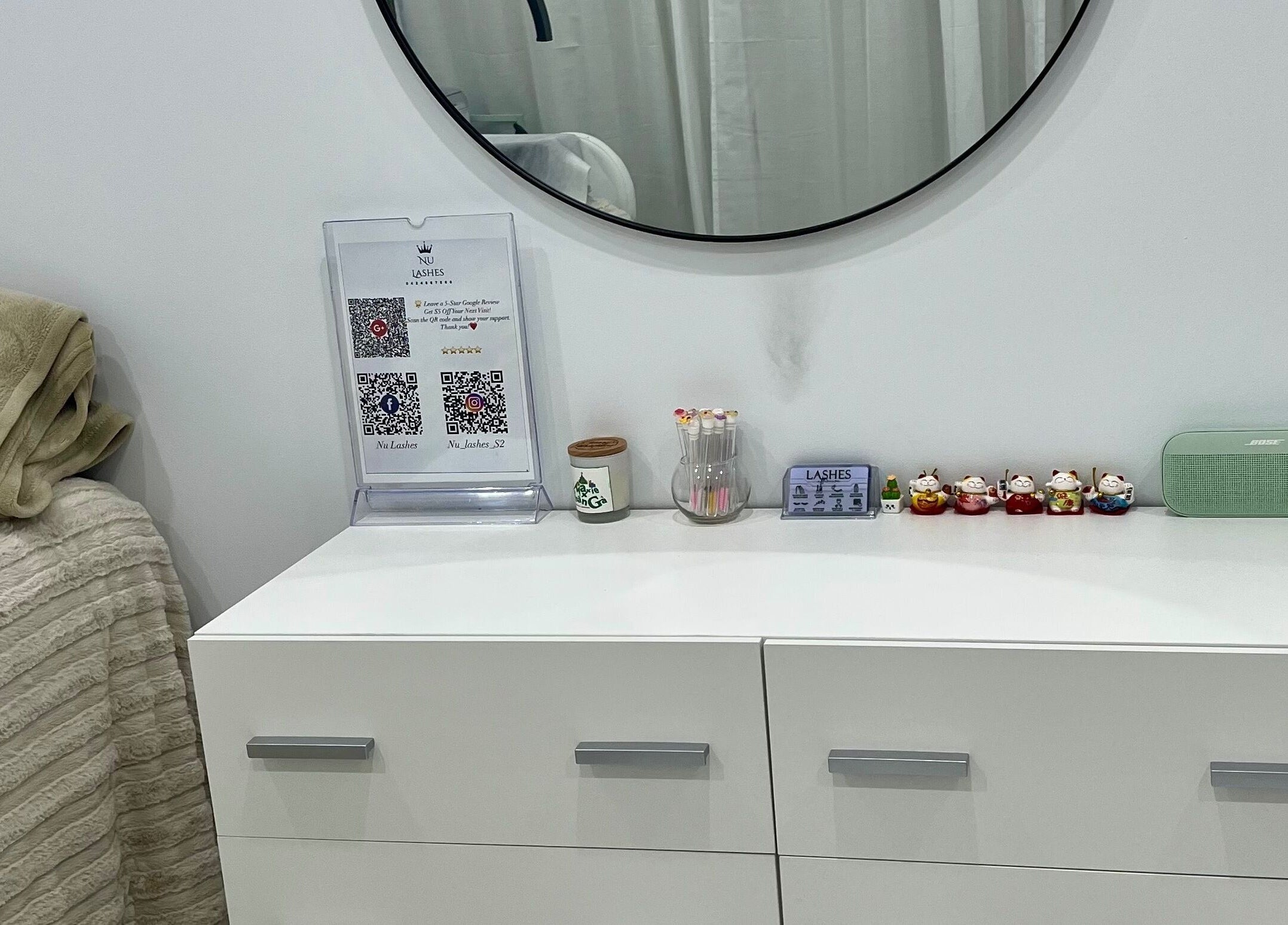 Elegant vanity with decor at Nu Lashes, Yagoona, New South Wales, AU, showcasing beauty and calmness.