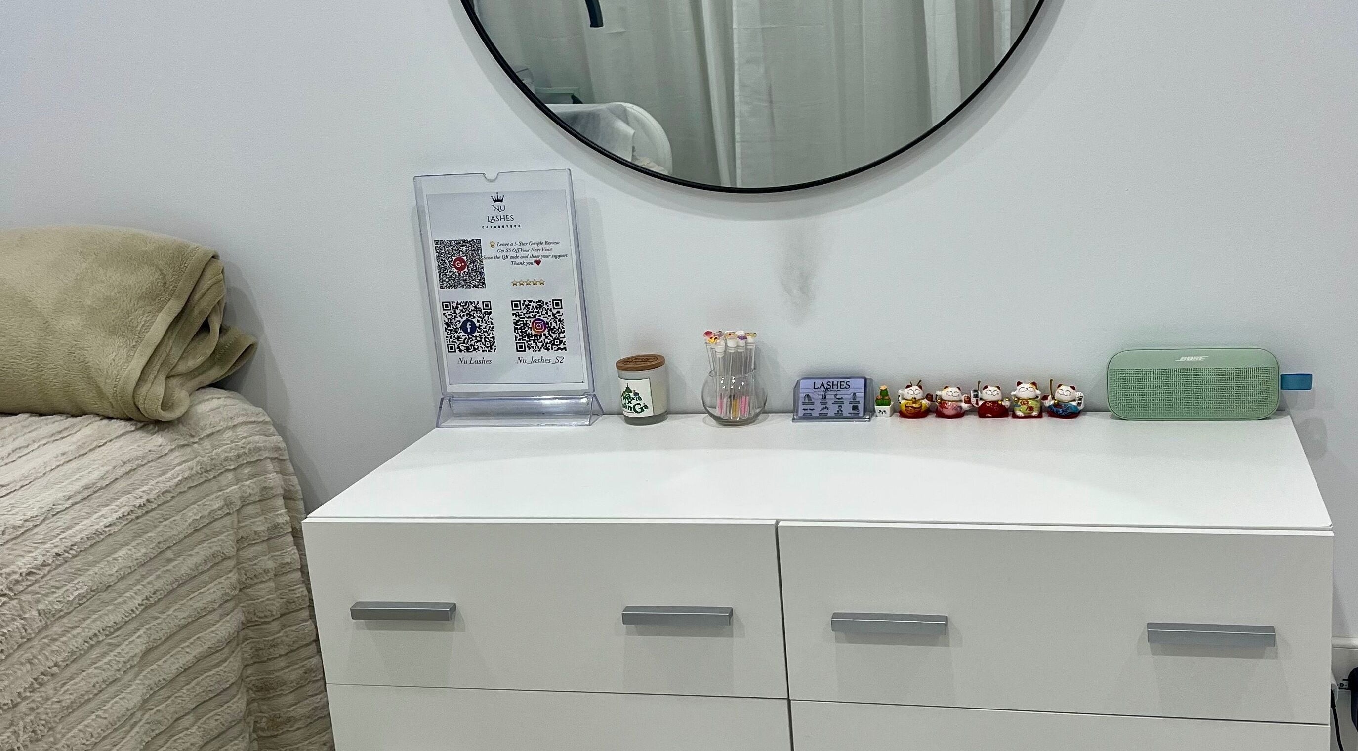Elegant vanity with decor at Nu Lashes, Yagoona, New South Wales, AU, showcasing beauty and calmness.