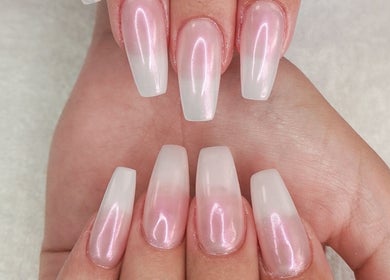 Elegant gel manicure at Nails by Nashy, Cape Town, Western Cape, ZA. Glossy pink and white nails on hands.