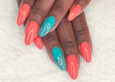 Vibrant orange nails with teal accents at Nails by Nashy, Cape Town, Western Cape, ZA.