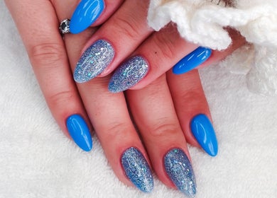 Vibrant blue and glitter nails beautifully styled at Nails by Nashy, Cape Town, Western Cape, ZA.