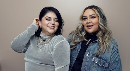 Two women smiling at Fiu Fiu Studio, Chula Vista, California, US, showcasing fashion and beauty.