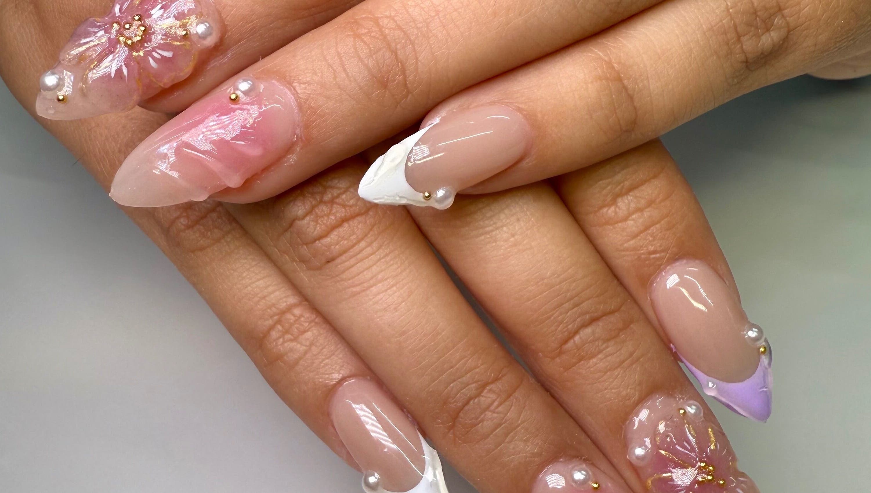 Intricate nail art with floral designs at Fiu Fiu Studio in Chula Vista, California, US.